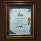 Framed certificate of award with logos and text on a dark background by dr bilquis