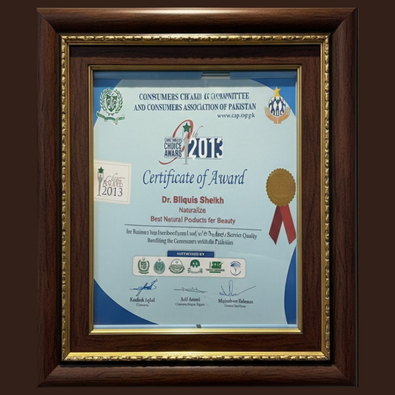 Framed certificate of award with logos and text on a dark background by dr bilquis